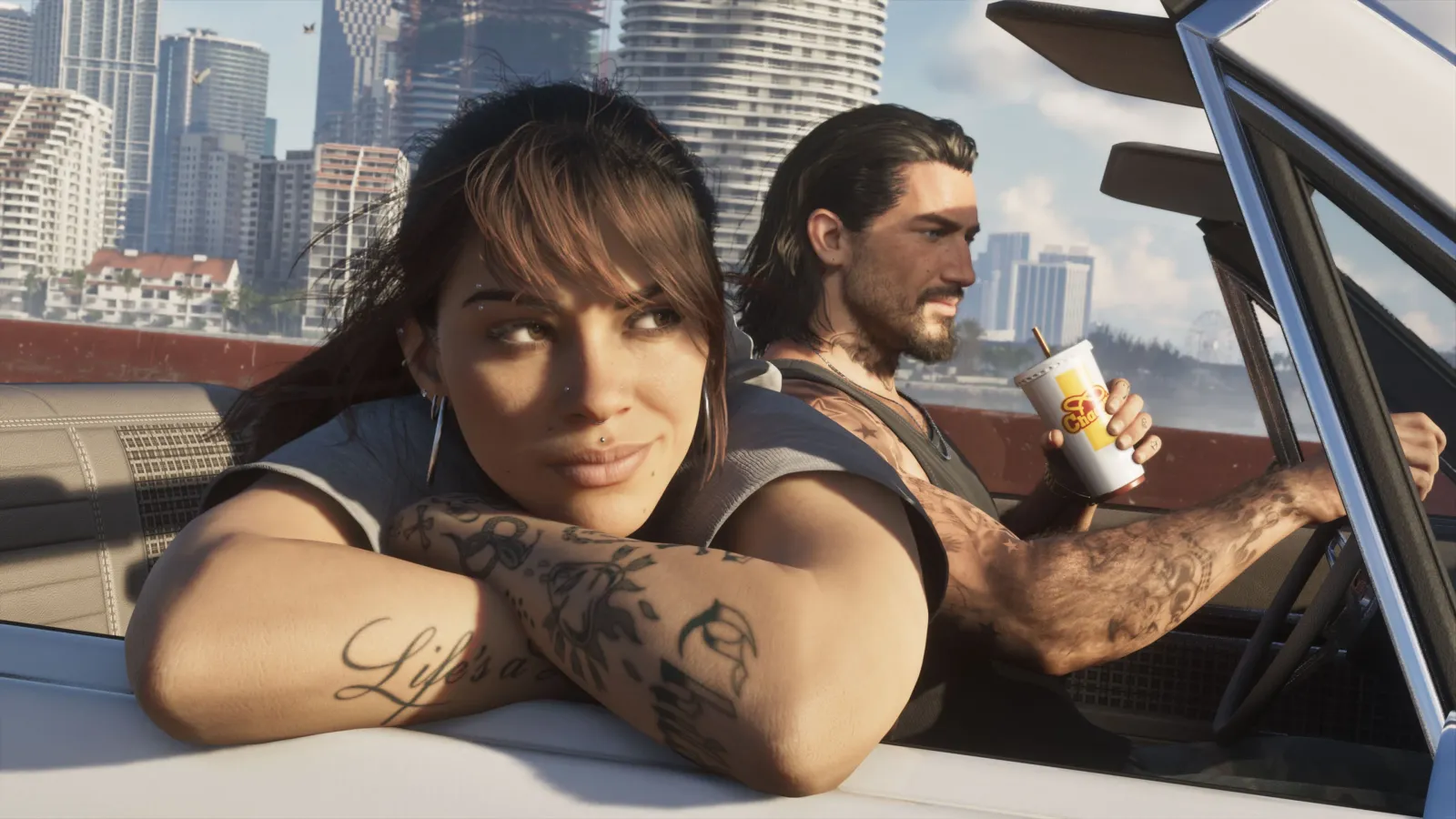 Lucia leans out of a convertible while Jason drives through Vice City in an official GTA 6 screenshot.