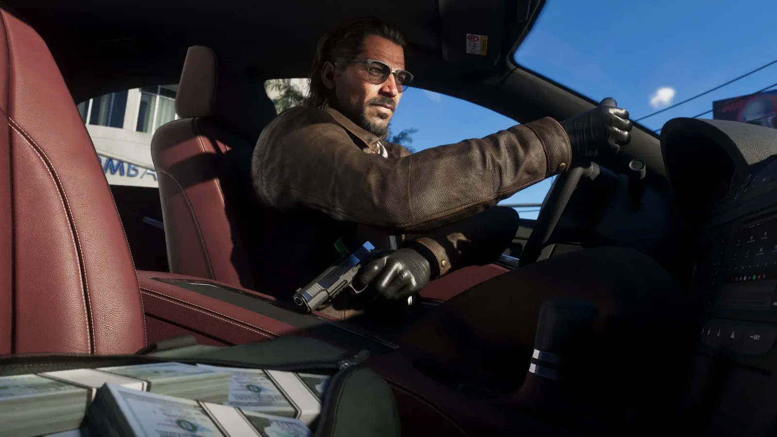 Raul Bautista sits at the wheel wearing gloves, with a handgun and a bag of cash beside him.