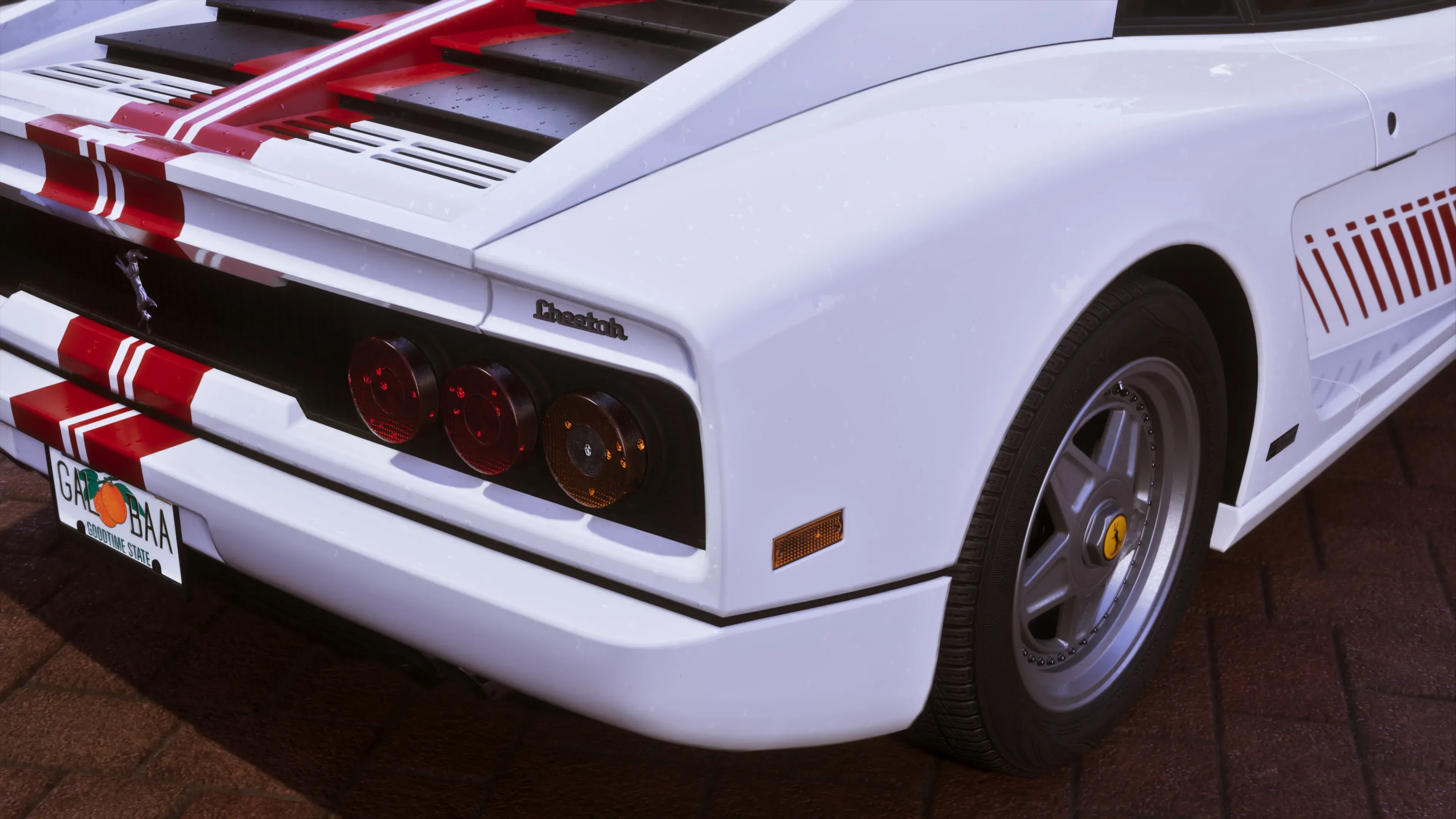 Rear Cheetah badge, round taillights and red-striped bodywork.