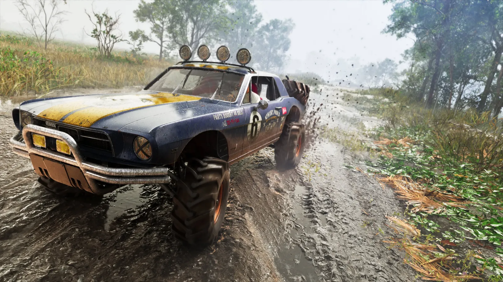 Blue and yellow Vapid Dominator Buggy driving through mud on large tires.